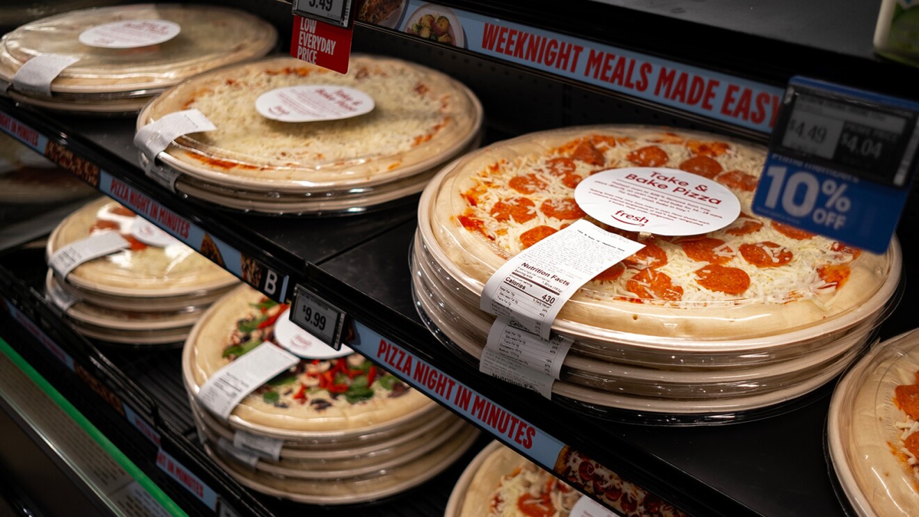 A photo of pizzas on display for sale inside an Amazon Fresh store.