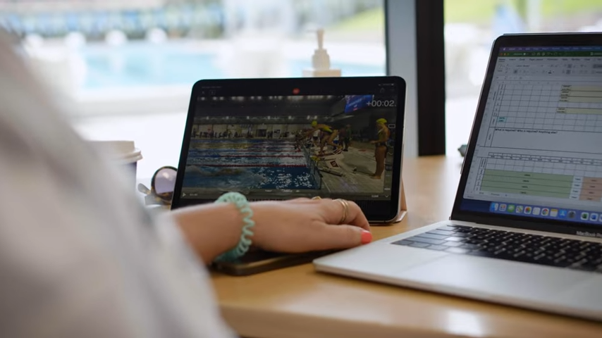 Someone is reviewing swimming performances data