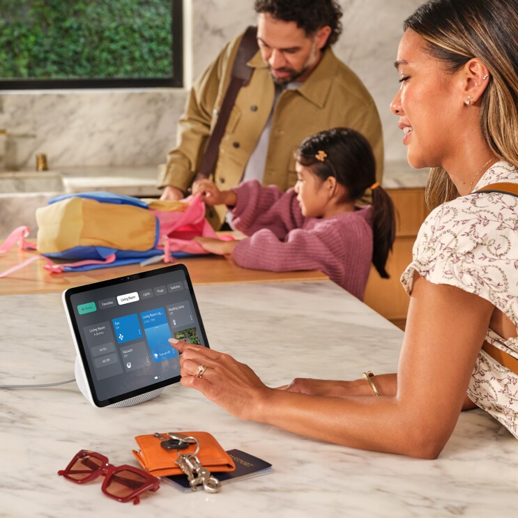 Image of an Echo Show 11 being used by a mother on a kitchen counter