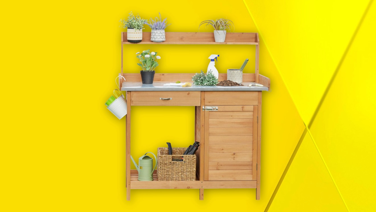 Wooden potting bench with plants, gardening tools, and storage cabinet against bright yellow wall