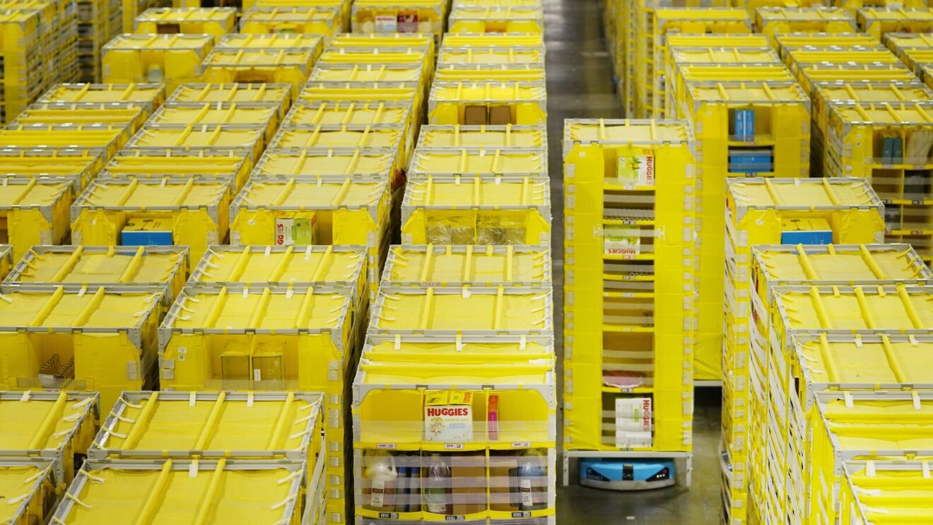 A robot moving stacks of packages at a fulfillment center