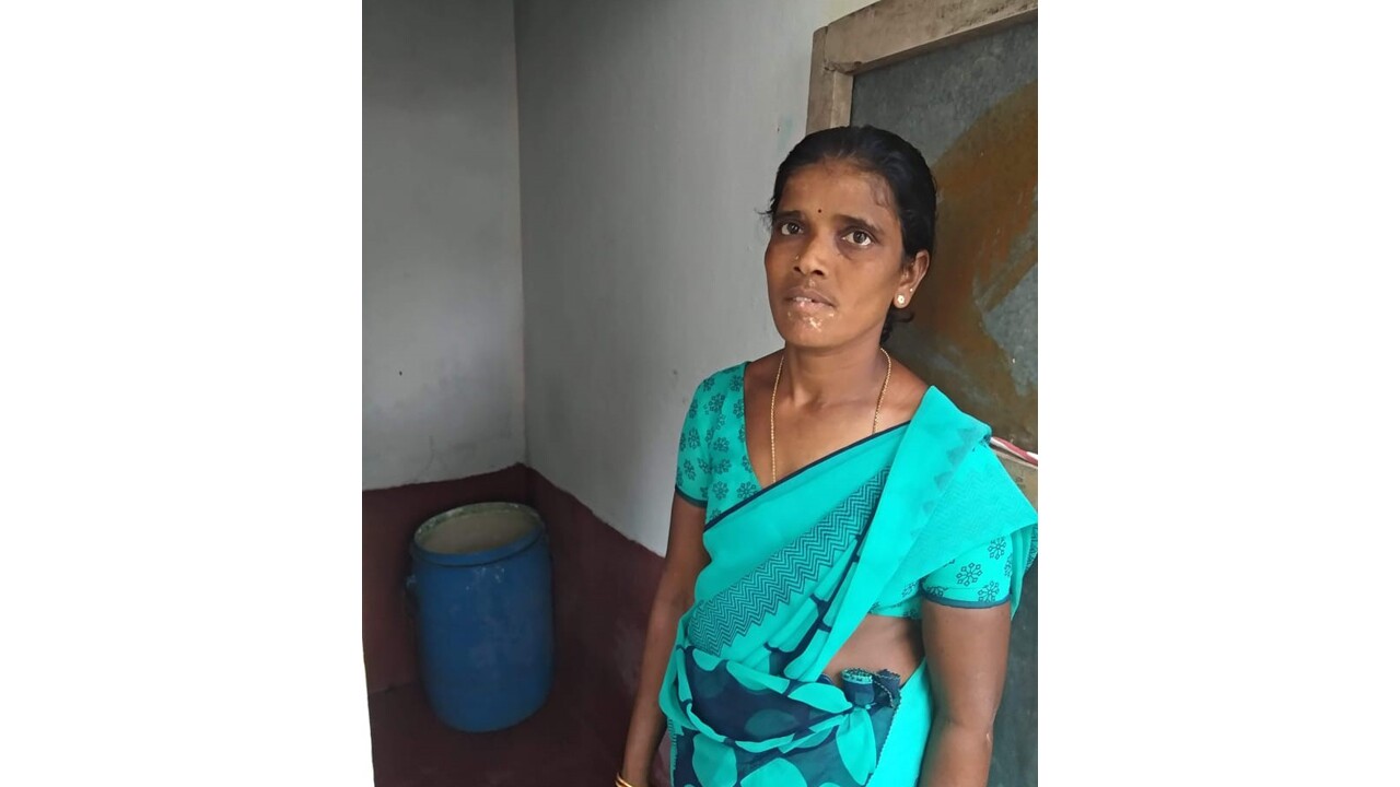 An image of a woman standing for a photo.