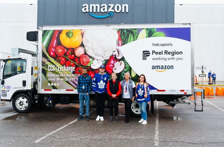 people standing in front of truck