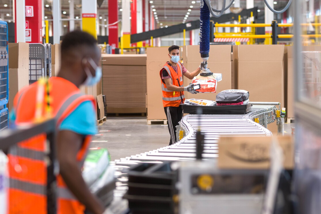 Item lifter.jpgtwo amazon employees and an item lifter