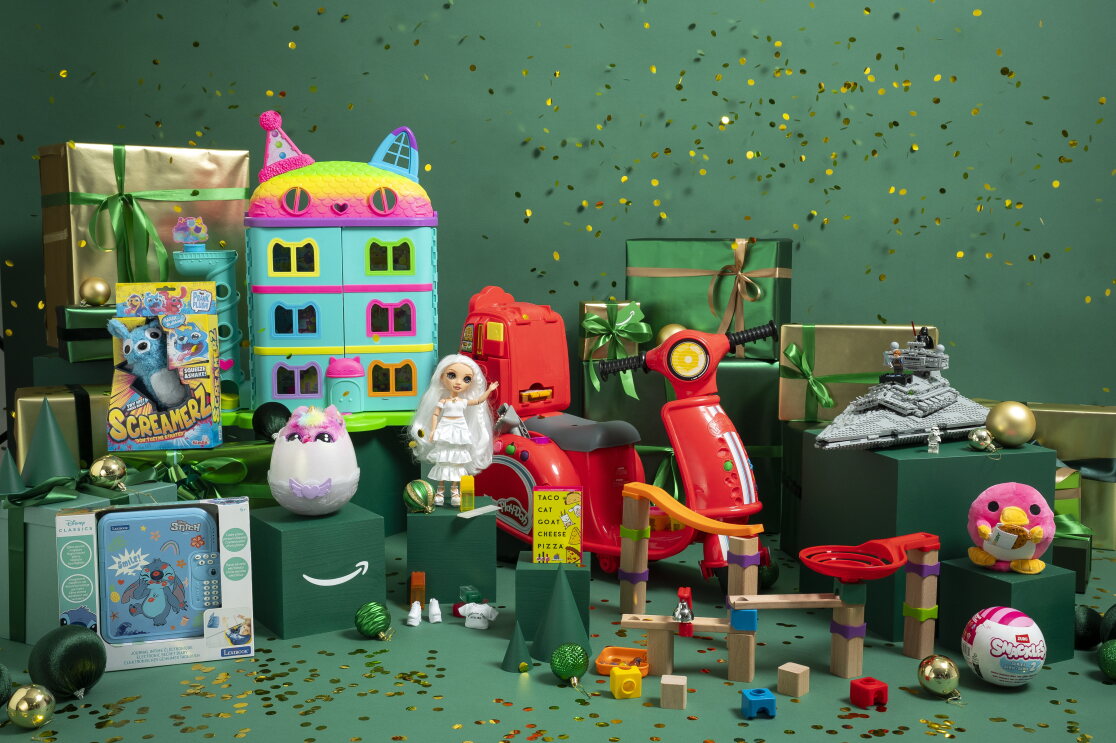 The toys featured in Amazon Top Ten Toys lists surrounded by christmas packaging 