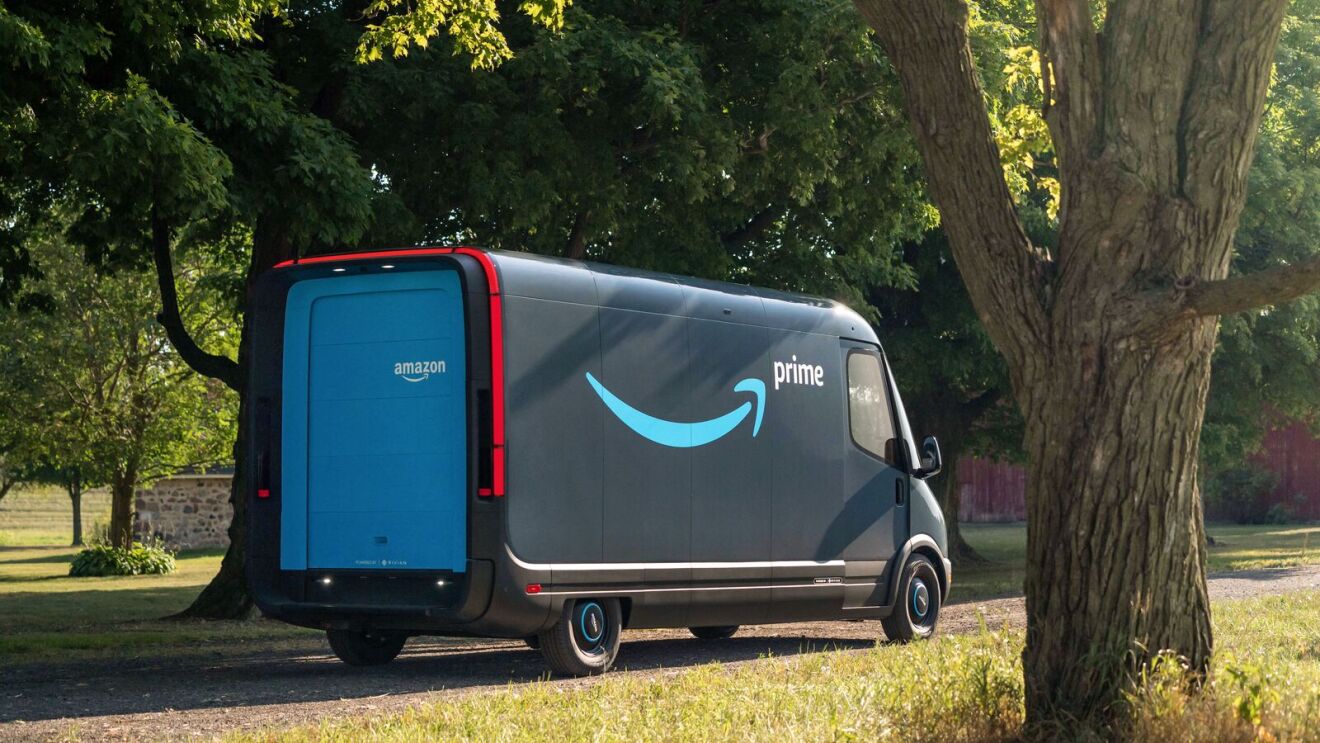 Amazon Delivery Van powered by Rivian driving down the road