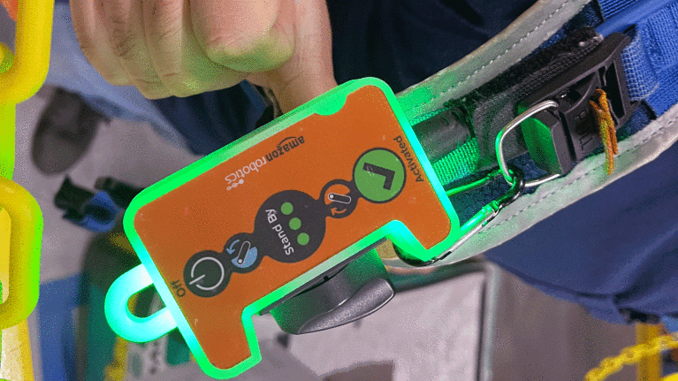 An image of an orange device with buttons on it that allow you to control and activate the vets it's attached to.