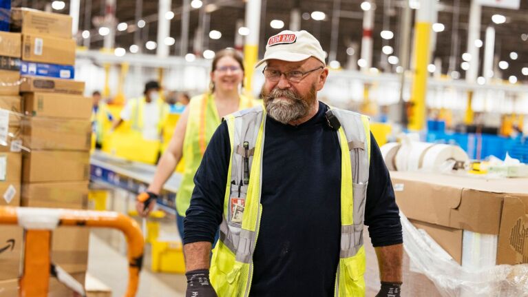 Amazon employees working in a fulfillment center