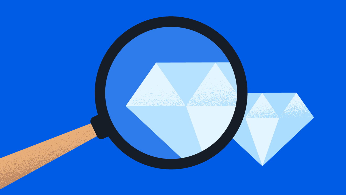 Blue backdrop with magnifying glass focused on geometric diamonds
