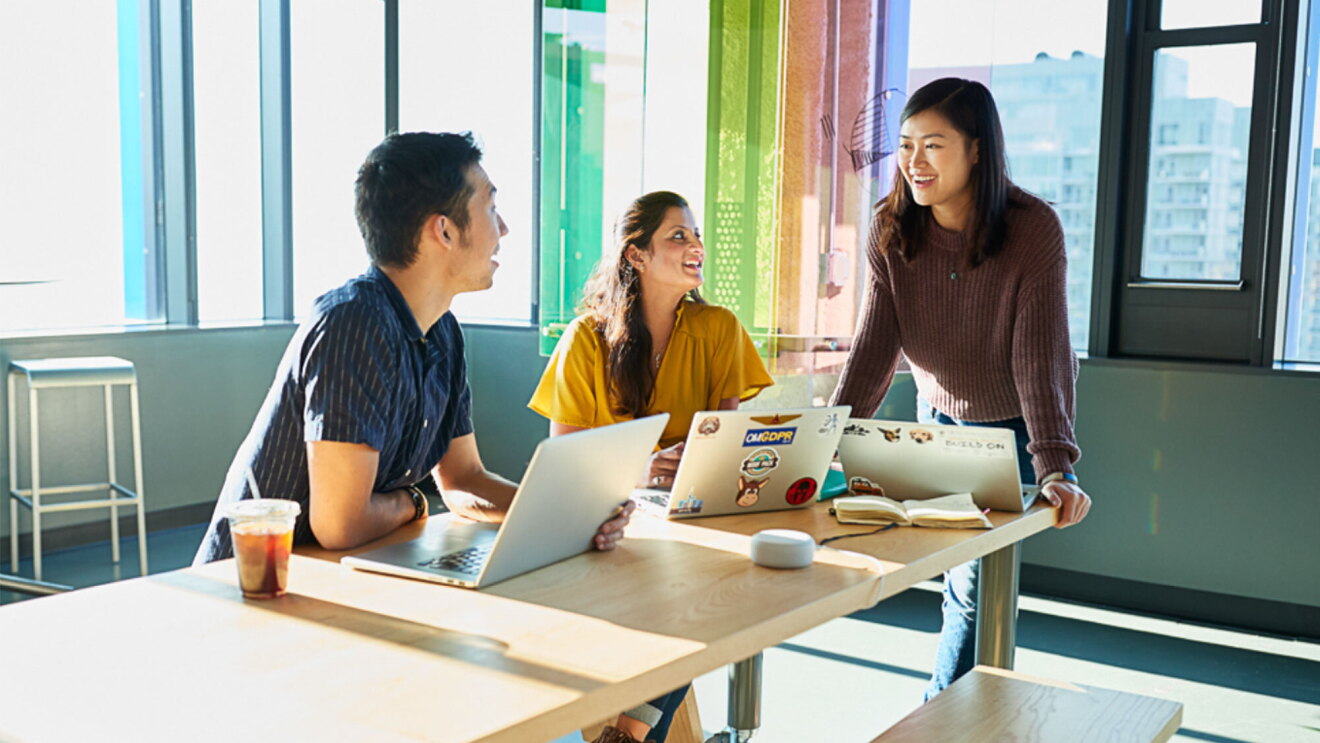 Tech employees work together at an Amazon office
