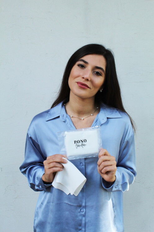 Mariana Santos, Founder of PONO London holding one of her products.