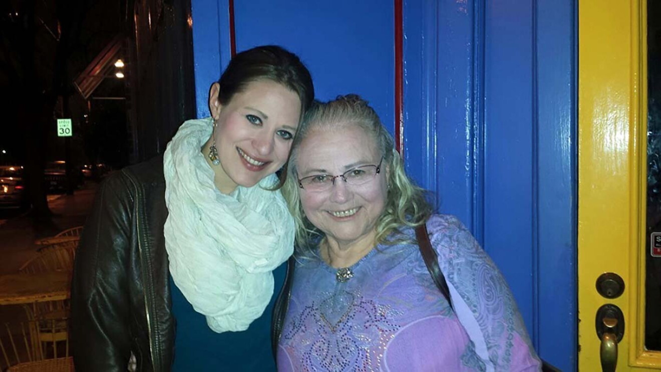 Two women who are related stand together