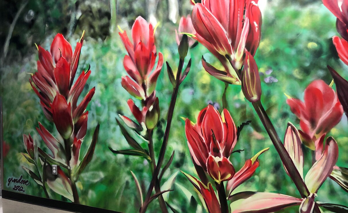 A painted mural of red flowers at the Amazon Denver office.