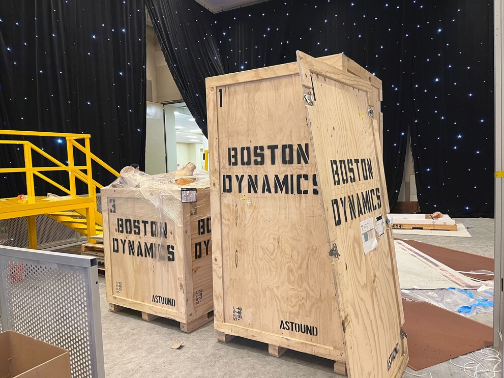 An image of shipping crates that say "Boston Dynamics" on them.