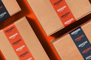 An image of Amazon boxes with the blue and orange tape assigned for the Cyber Monday and Black Friday deals season in 2022