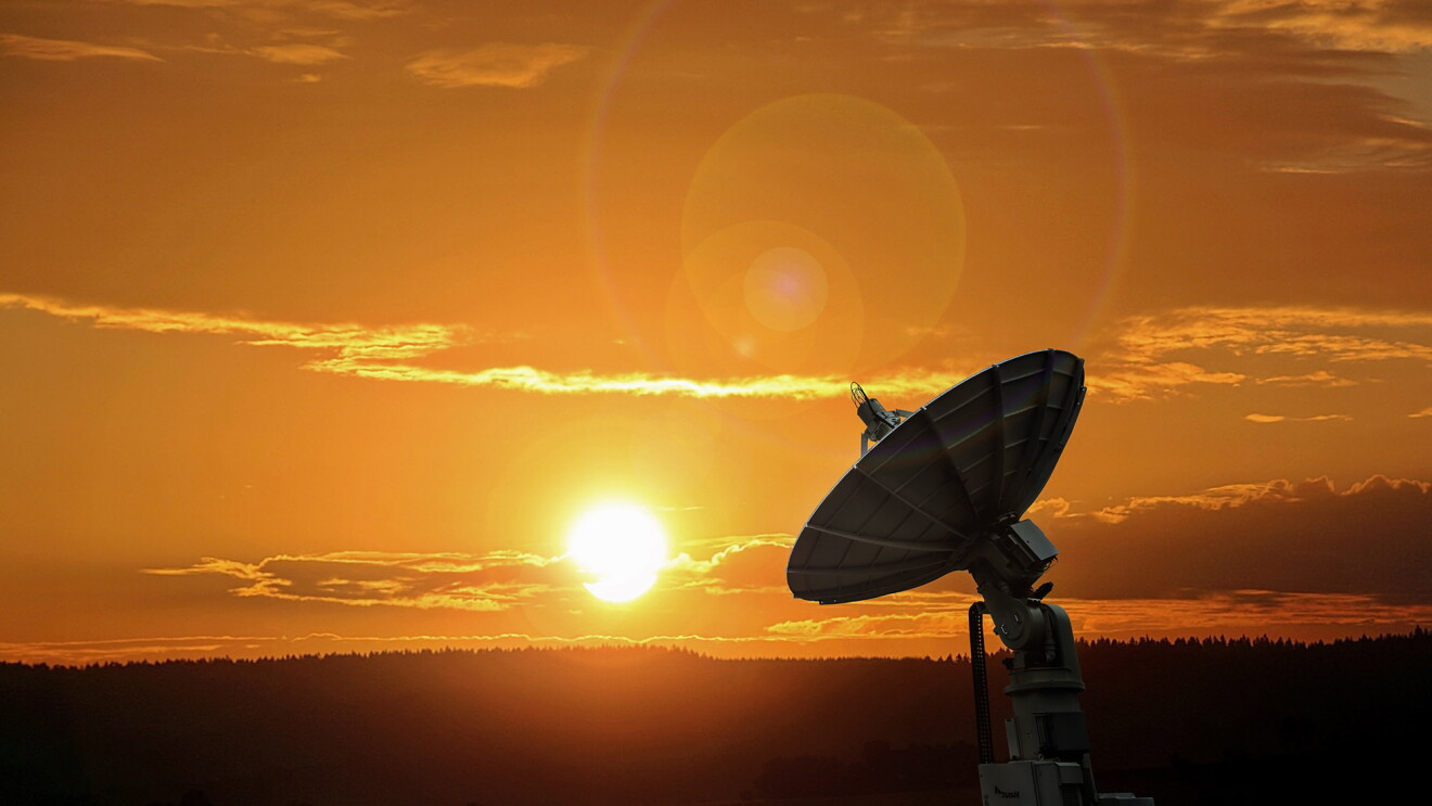 Amazon Web Services satellite shown in natural, outdoor environment.