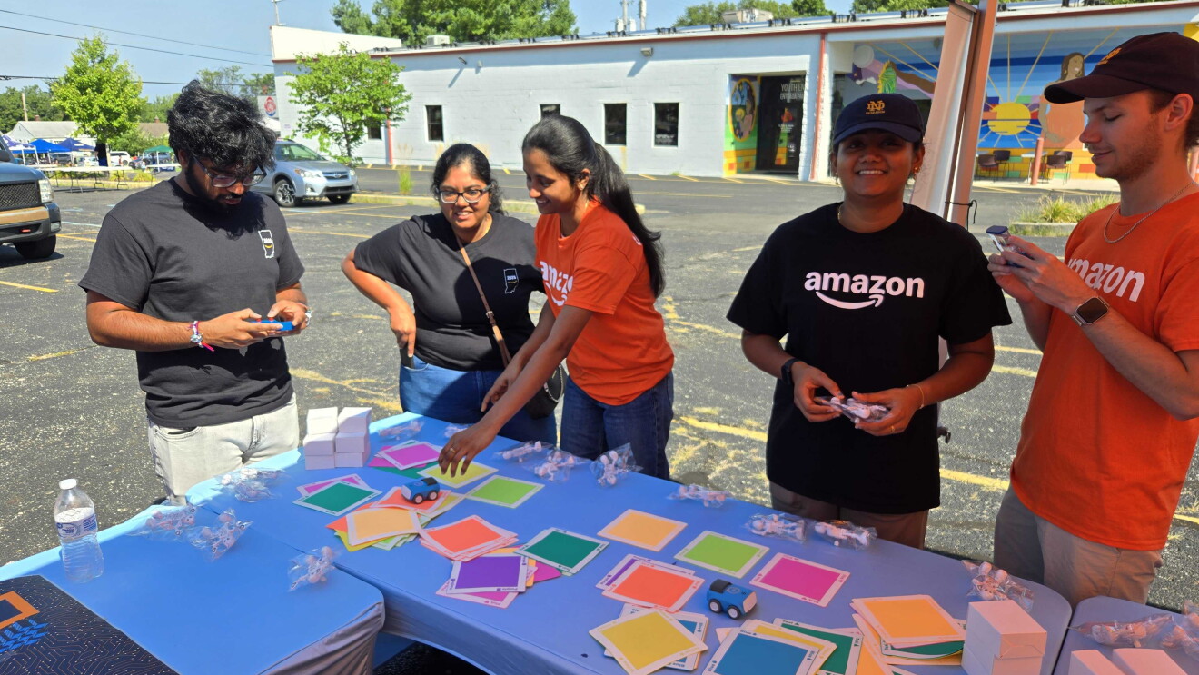 Employees in Amazon shirts participating in team-building exercise