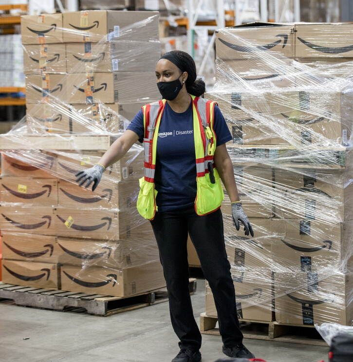 An Amazon employee prepares products for distribution at the Amazon Disaster Relief Hub in Atlanta, Georgia. 