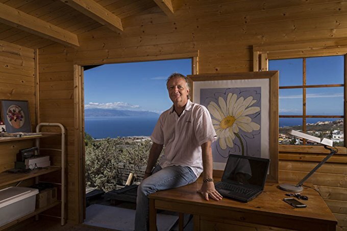 Tenerife-based author Joe Cawley at his desk overlooking the Canary Islands coast
