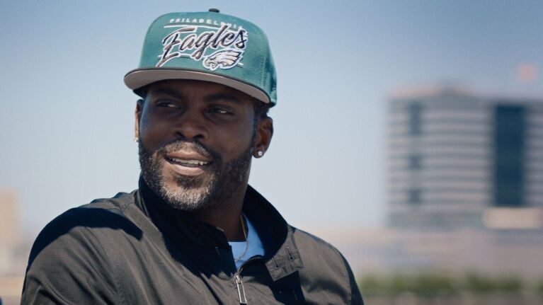 Former NFL quarterback Michael Vick talks during an interview.