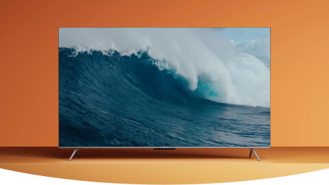 Image of a Fire TV in front of an orange background