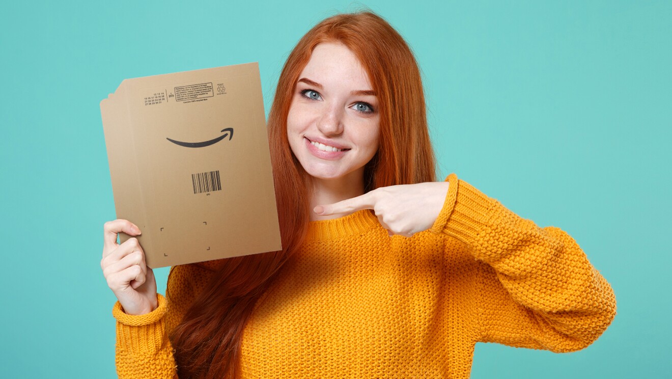 Young woman holding an Amazon Sustainable Packaging Envelope