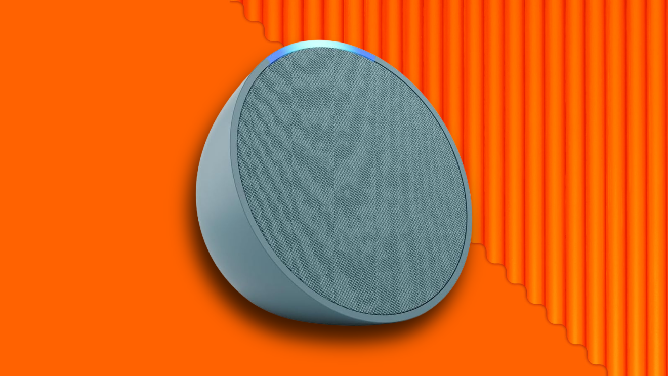 Light blue Amazon Echo Dot smart speaker on vibrant orange background
