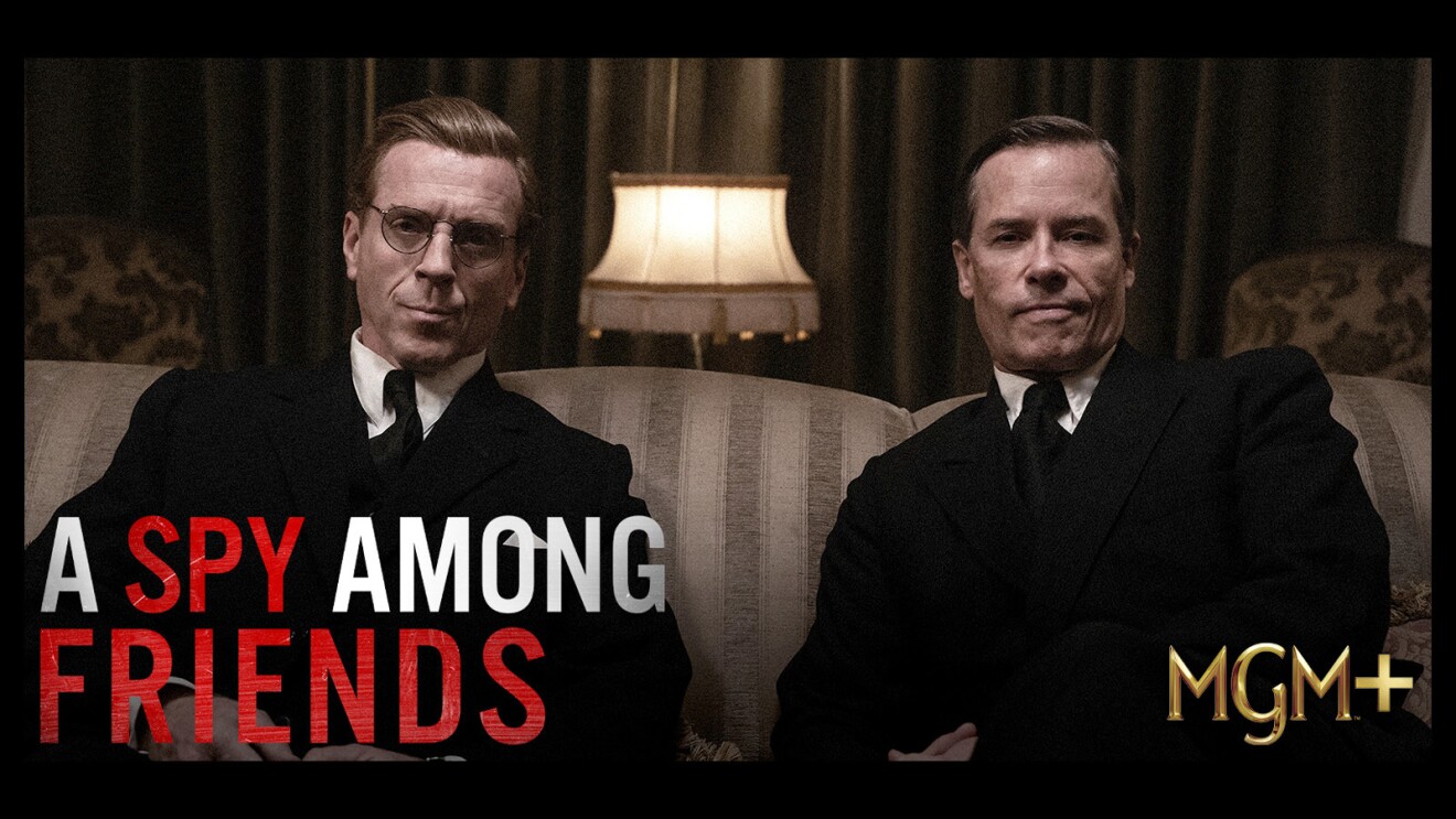 The cover of "A Spy Among Friends" Showing two men sitting on a sofa and the MGM+ logo on the bottom right corner.