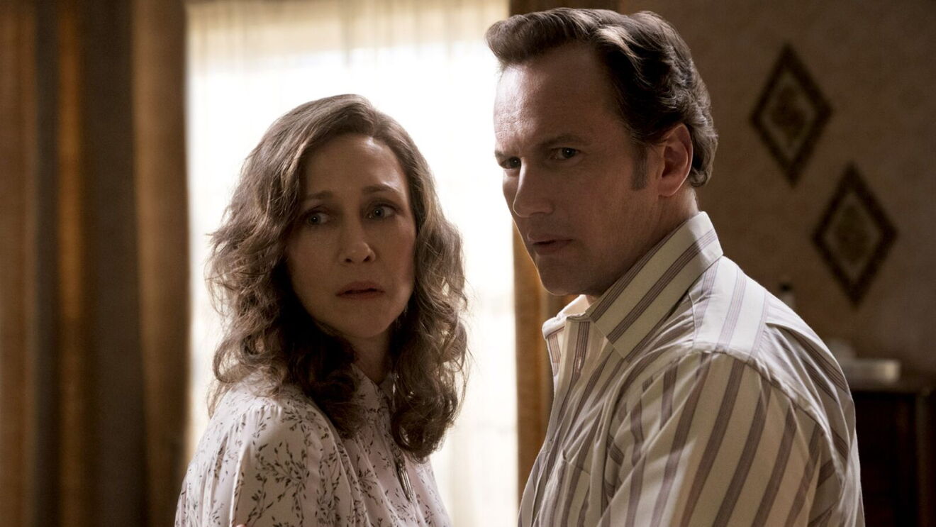 The Conjuring movie: Middle-aged couple in tense conversation, woman in floral blouse, man in striped shirt