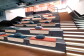 A hall with many pillows placed on the stair seats
