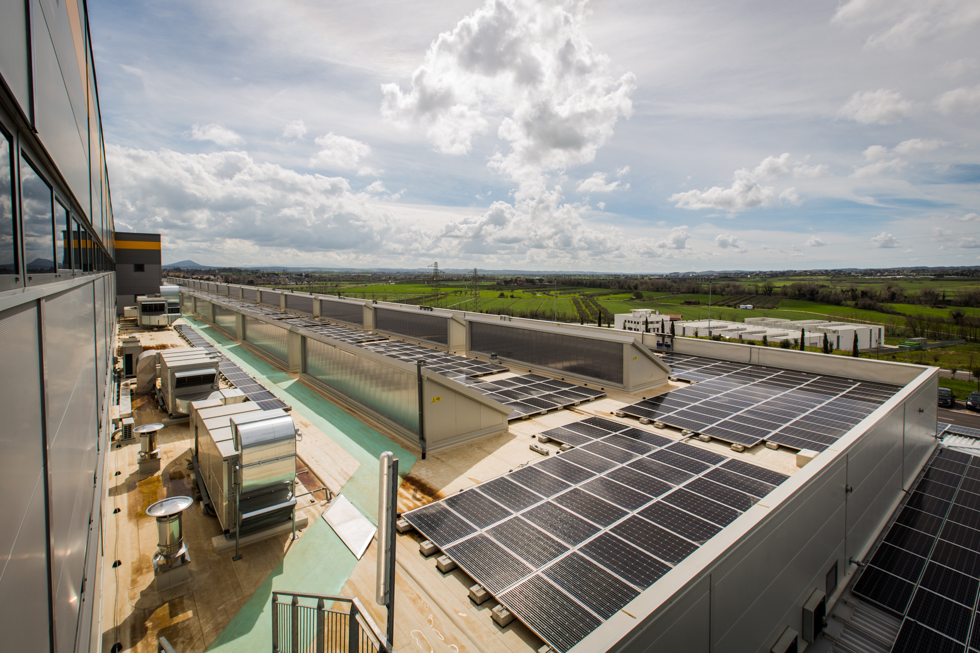 Solar panels on the roof of an Amazon fulfillment center in Italy