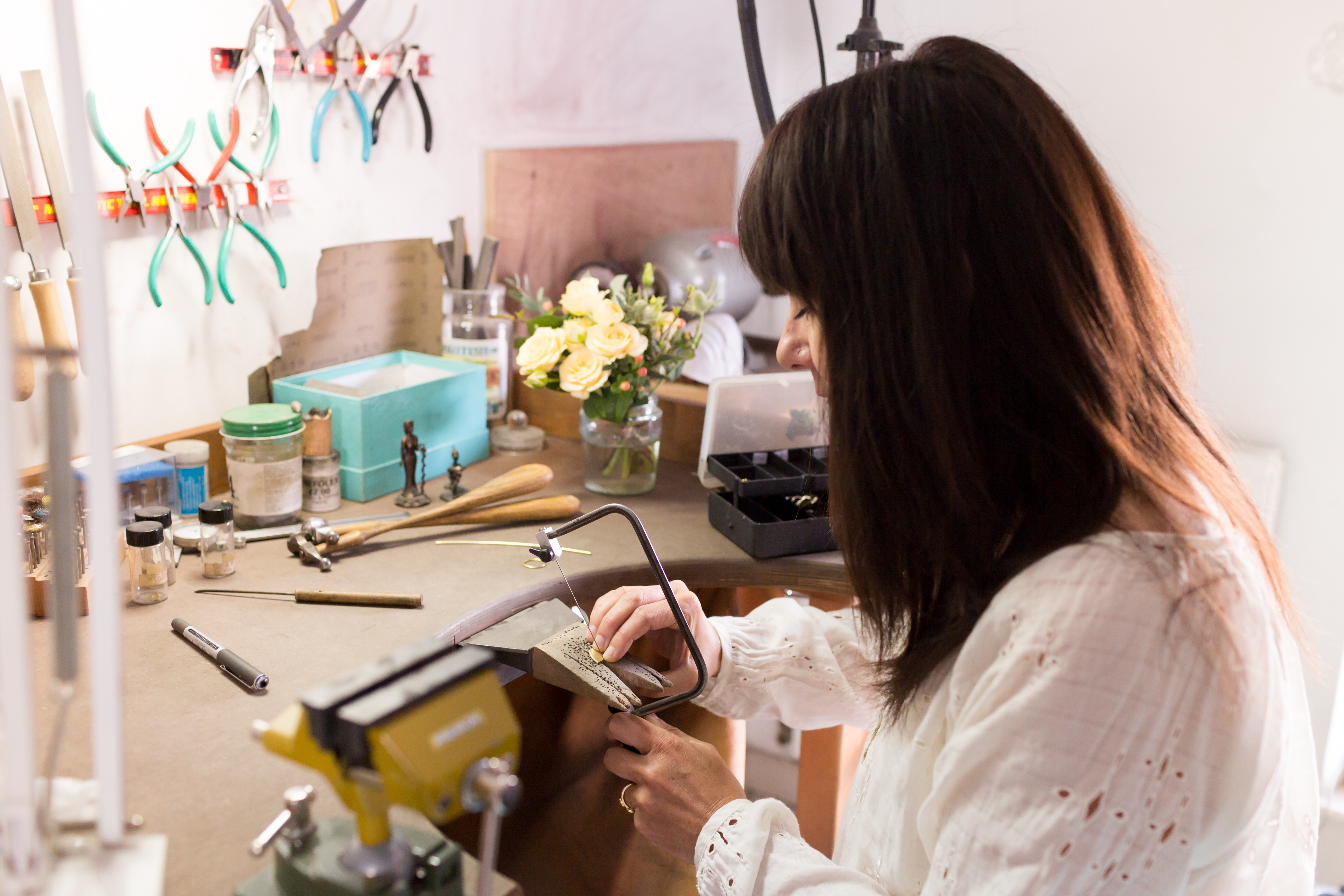 Female entrepreneur at work in her crafts studio 