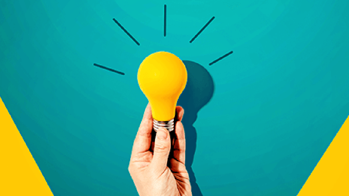 A hand holds a lightbulb in front of an aqua and yellow background. The bulb is yellow, and has illustrated lines coming off of it. 
