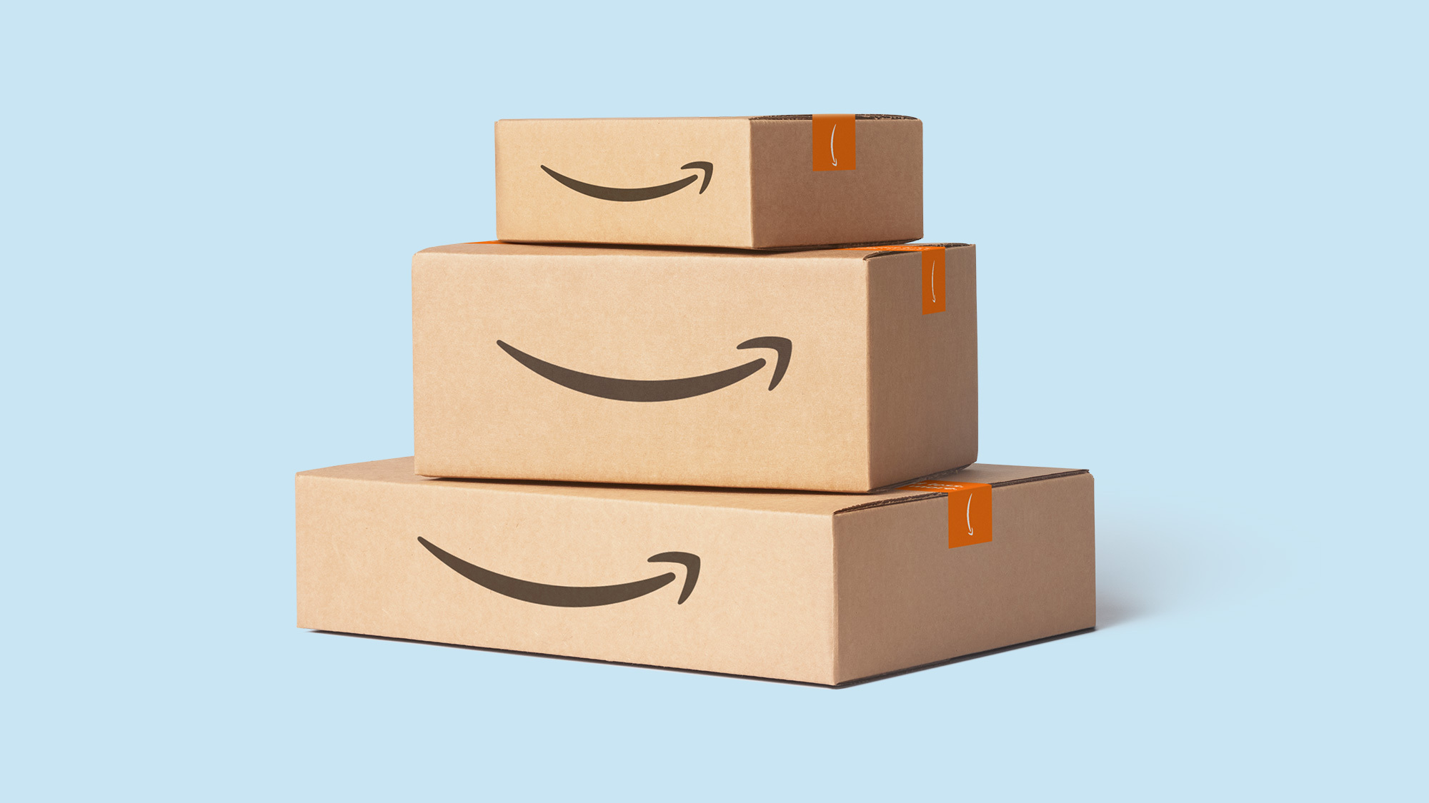 Three Amazon boxes stacked on top of each other, making a small tower