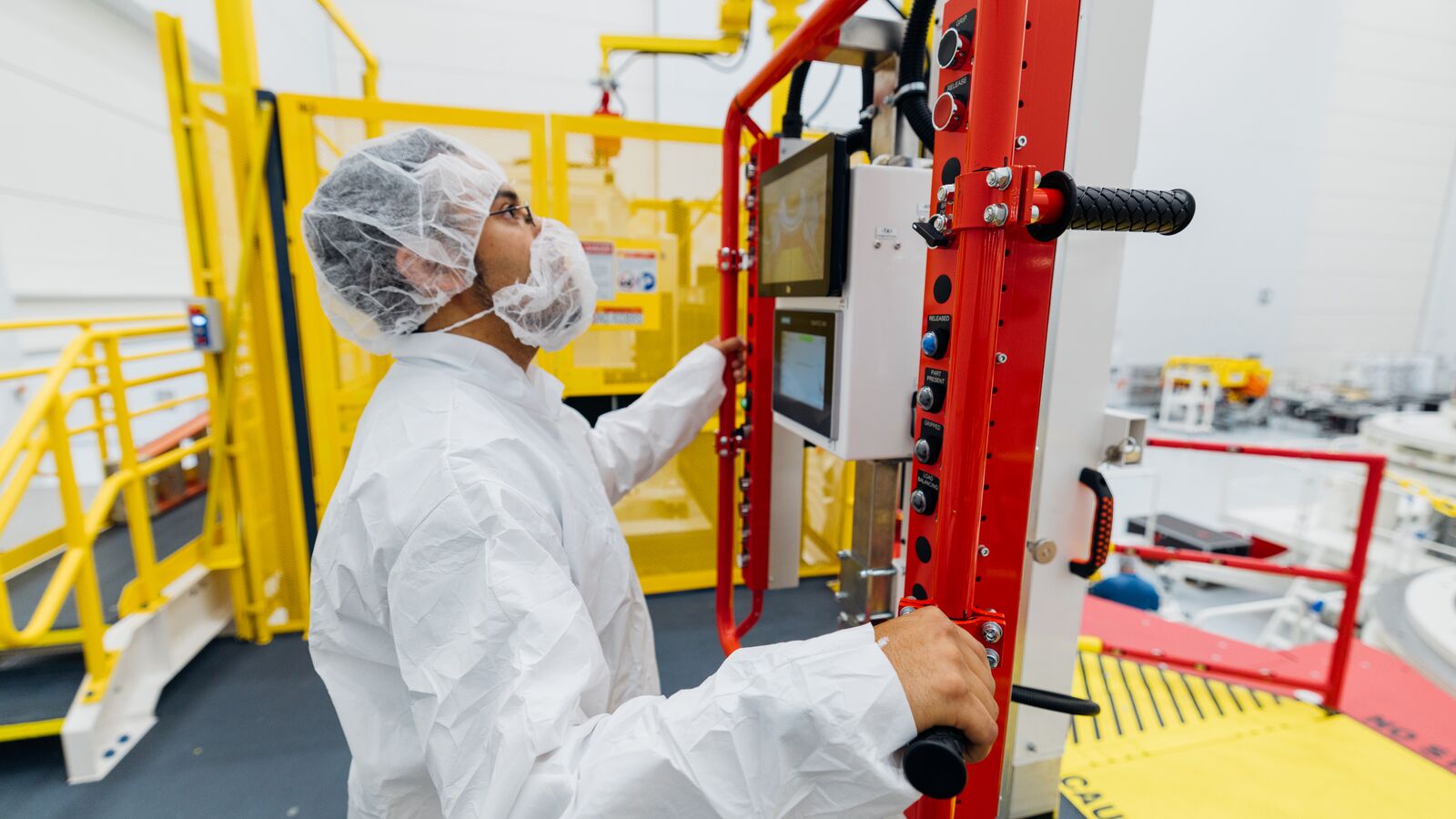 An employee working inside of Project Kuiper facility