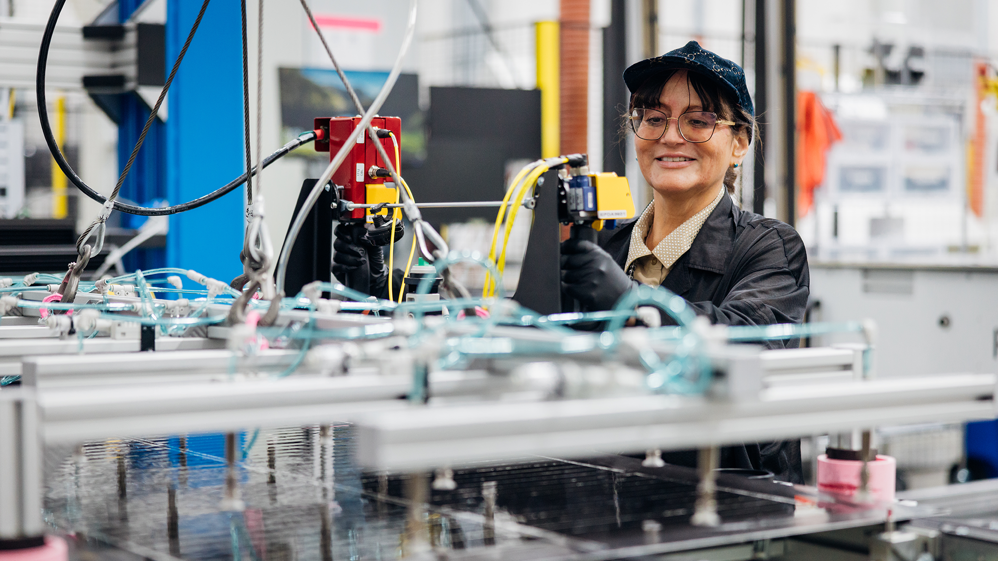 A technician working on Project Kuiper material